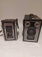 Front view of both Kodak cameras side by side