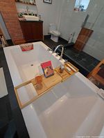 Tray on bathtub showing compartments in use