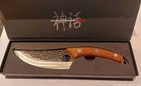 Knife in fitted presentation box showing blade and handle