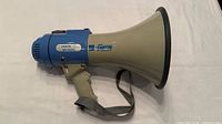 Left side view showing entire megaphone with strap