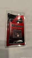Front view of sealed Pearstone OLM-10 lavalier microphone package