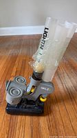 Front view of SKLZ pitching machine showing feed tube and launch wheels