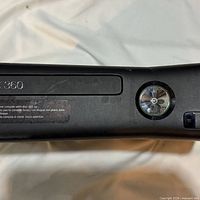 Front of Xbox 360 S console showing disc tray and power button