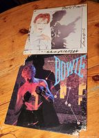 Front covers of both David Bowie LPs, showing artwork and edge damage to Let’s Dance jacket