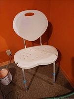 Front view of bath bench showing seat, backrest and legs