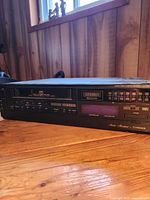 Front and left angle view of Fisher FVH-C830 VCR showing display and controls