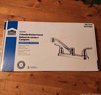Retail box showing Project Source Dover 2-Handle Kitchen Faucet, chrome finish