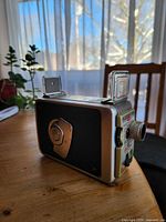 Side view showing leatherette panel and pop-up viewfinders