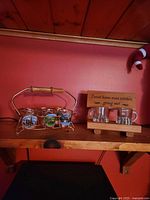 Overall view of carrier with six decal shot glasses and wooden stand with two mug shot glasses