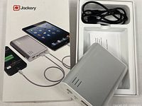 Retail box, power bank, cable, instructions visible