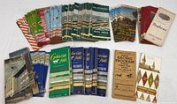 Grouped spread of vintage horse racing programs from multiple tracks