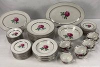 Full 68-piece Embassy Rose vitrified china service displayed