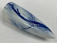 Full view of porcelain wall pocket vase showing overall shape and decoration