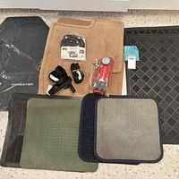 All mats, pump, and tie-downs arranged on floor