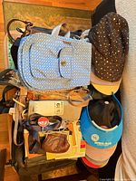 Overview of bags, visors and pouches on table