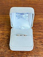 Ring in open jewellery box showing overall appearance