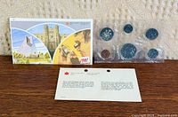 Outer sleeve, information card and sealed coin pack front view