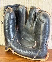 Front palm view showing three-finger design and leather condition