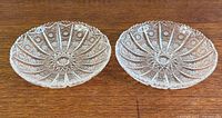 Two Bohemian crystal dishes top view showing starburst pattern