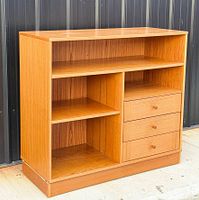 Full view of Denka teak cabinet front showing shelves, drawers, finish