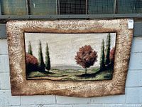 Full view of tapestry hung on wall