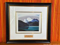 Full view of framed and matted print under glass on display stand