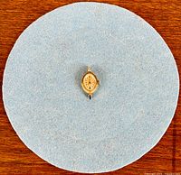 Full view of Omega watch head on blue cloth