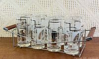 Set of eight Silver Foliage glasses in chrome caddy