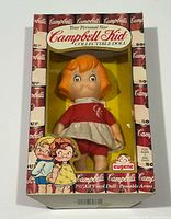 Front view of boxed Campbell Soup Kid doll