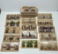 Overview of 29 stereoview cards laid out plus stacks