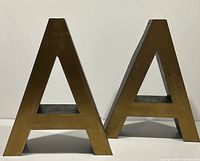 Front view of both brass letters A