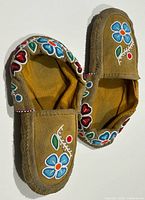 Top view showing overall moccasin pair and beadwork