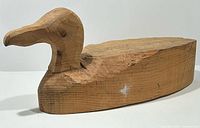 Front-angled view of unfinished wood duck decoy