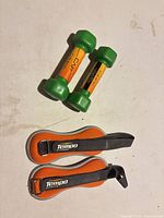 overview of two CAP dumbbells and two Tempo strap weights