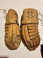 Pair of gloves tops showing brand markings and condition