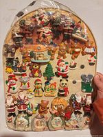 Full view of arched board with all magnets and torn plastic cover