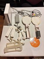 Overview: console, controllers, cables, attachments, disc