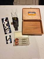 Entire lot showing darts, cases, flight and shaft packs, wooden box