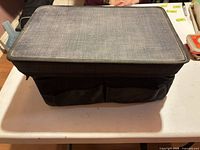 Top and front view of charcoal car tote with mesh front pockets