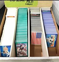 Box with three rows of 1991 Score cards in teal, blue and white backs