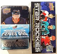 Series One tin and Star Rookies box set side by side, factory sealed