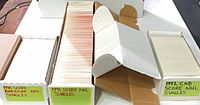 Four long card boxes filled with Score NHL singles labelled 1990 American, 1991, 1992 CND