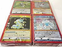 Four sealed event decks showing promo cards