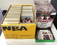 Bulk box of standard 1990s NBA cards and sealed Bowman University boxes
