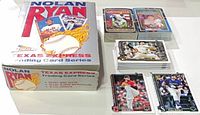 Open Nolan Ryan Texas Express box, two Diamond King sets, stack of Topps singles, two sample singles displayed