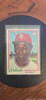 Front view of Lou Brock O-Pee-Chee card inside sleeve/top loader