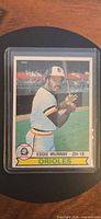Front view of Eddie Murray Topps card in protective sleeve