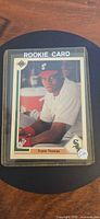 Front of Frank Thomas rookie card in sleeve and top loader