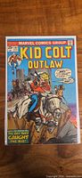 Front cover of Kid Colt Outlaw #197 in bag and board