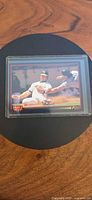 Front of 1993 Triple Play #68 Mark McGwire card in sleeve and top loader